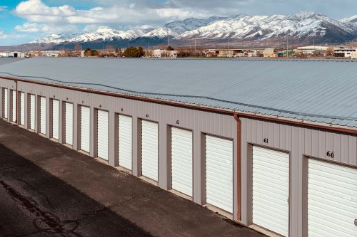 Aerial view of paint cans on a hexagonal tile floor, perfect for renovation themes.