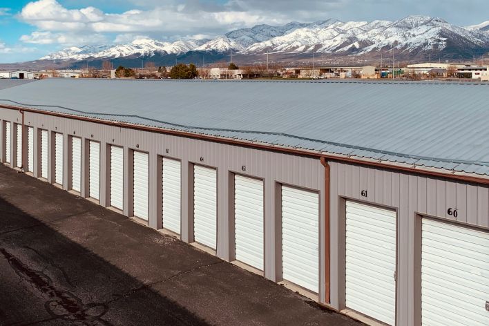 Aerial view of paint cans on a hexagonal tile floor, perfect for renovation themes.